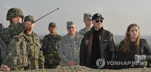 This file photo, taken Dec. 7, 2013, shows U.S. Vice President Joe Biden (2nd from R) visiting the Demiliterized Zone separating the two Koreas. (Pool photo) (Yonhap)