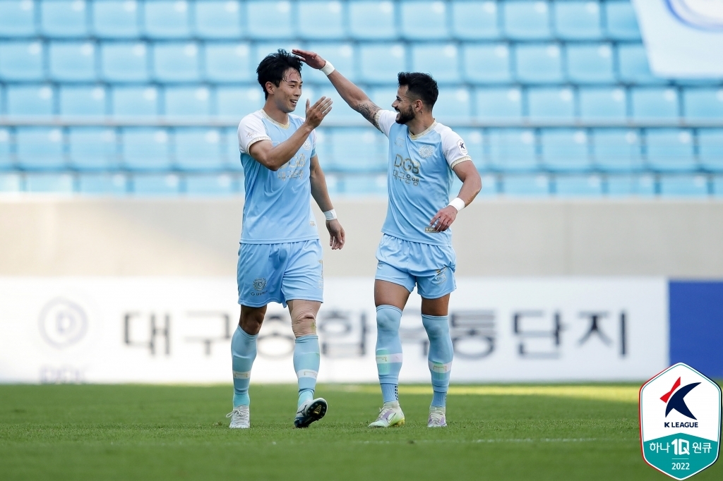 Kim Jin-hyuk of Daegu FC (L) is congratulated by teammate Cesinha after scoring a goal against Gangwon FC during the clubs' K League 1 match at DGB Daegu Bank Park in Daegu, 300 kilometers southeast of Seoul, on May 22, 2022, in this photo provided by the Korea Professional Football League. (PHOTO NOT FOR SALE) (Yonhap)