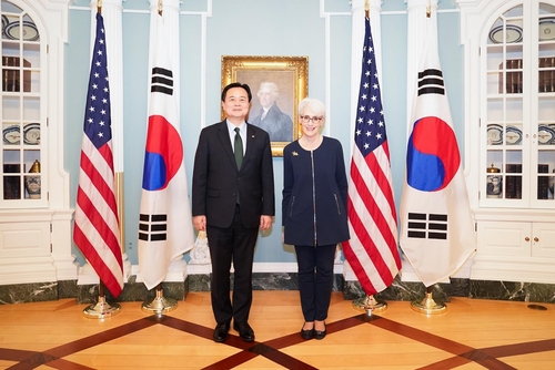 South Korean First Vice Foreign Minister Cho Hyun-dong (L) and U.S. Deputy Secretary of State Wendy Sherman pose for a photo during their bilateral talks in Washington on Feb. 14, 2023, in this photo provided by South Korea's foreign ministry. (PHOTO NOT FOR SALE) (Yonhap)