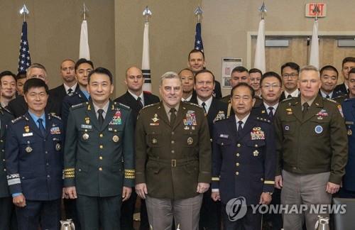 South Korea's Joint Chiefs of Staff (JCS) Chairman Gen. Kim Seung-kyum (2nd from L), his U.S. counterpart, Gen. Mark Milley (C), and his Japanese counterpart, Gen. Koji Yamazaki (2nd from R), pose for a photo after trilateral talks in Washington on Oct. 20, 2022, in this file photo provided by Seoul's JCS. (PHOTO NOT FOR SALE) (Yonhap)