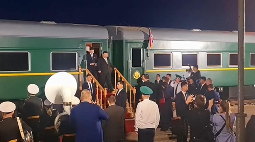 This photo, captured from Russian Natural Resources Minister Alexander Kozlov's Telegram post, shows North Korean leader Kim Jong-un stepping off his special train at the Khasan station in Primorsky Krai on Sept. 12, 2023. (PHOTO NOT FOR SALE) (Yonhap)