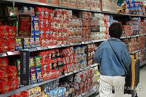 This file photo from Sept. 15, 2023, shows a person shopping for ramyeon at a supermarket in Seoul. (Yonhap)