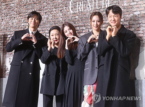 Cast members of Netflix's upcoming series "Gyeongseong Creature" pose for photos during a media event in Seoul on Dec. 19, 2023. (Yonhap)