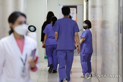 Medical workers walk at Chonnam National University Hospital in Gwangju, 267 kilometers south of Seoul, on Feb. 6, 2023. (Yonhap)