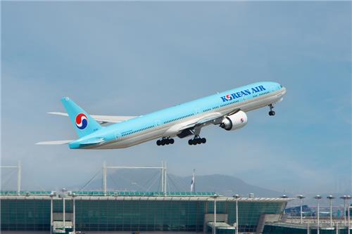 This file photo provided by Korean Air Co. shows one of its aircraft taking off at an airport. (PHOTO NOT FOR SALE) (Yonhap)