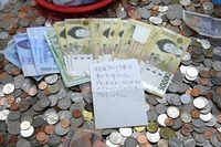 日本語で「子どもたちへ寄付を」　韓国空港の募金箱に１１万円相当の紙幣
