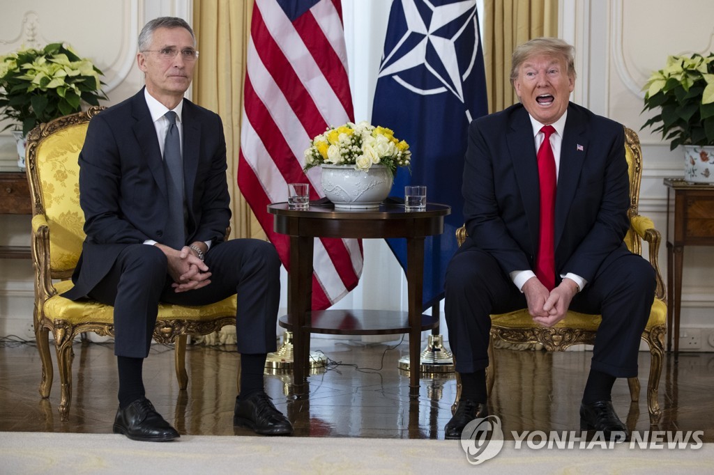 This AP photo shows U.S. President Donald Trump (R) speaking during a meeting with NATO Secretary General Jens Stoltenberg at Winfield House in London on Dec. 3, 2019. (Yonhap)