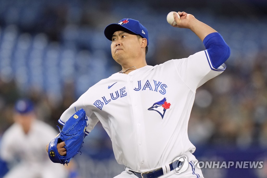 In this Canadian Press photo via the Associated Press, Toronto Blue Jays' starter Ryu Hyun-jin pitches against the Oakland Athletics during the top of the first inning of a Major League Baseball regular season game at Rogers Centre in Toronto on April 16, 2022. (Yonhap)