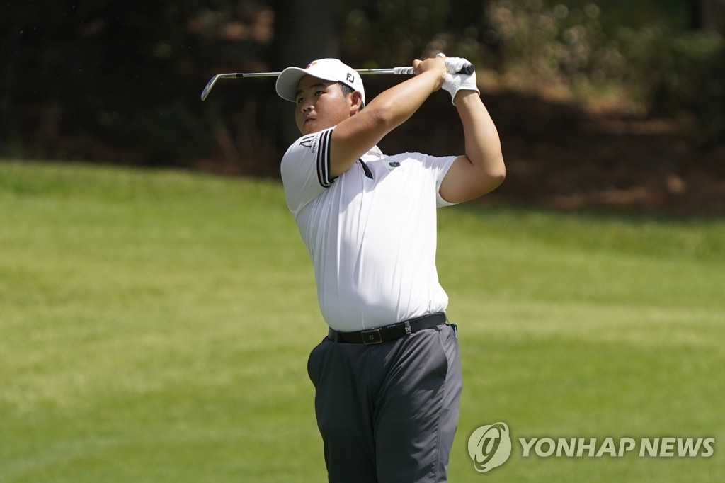 In this Associated Press photo, Kim Joo-hyung of South Korea hits his second shot on the eighth hole during the final round of the Wyndham Championship at Sedgefield Country Club in Greensboro, North Carolina, on Aug. 7, 2022. (Yonhap)