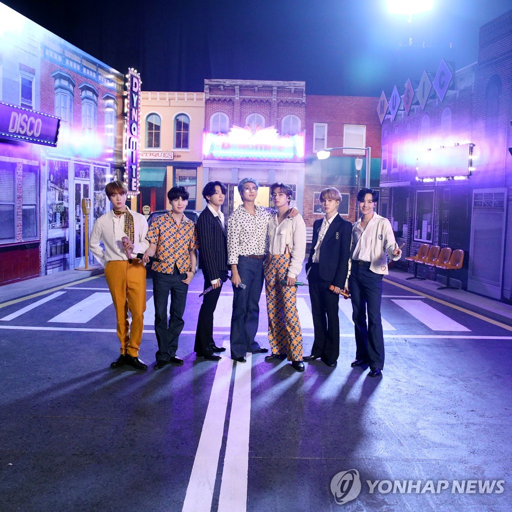 This photo provided by Big Hit Entertainment on Sept. 19, 2020, shows K-pop group BTS posing for a photo at a set in South Korea where the band filmed a performance for the iHeartRadio Music Festival in the U.S. (PHOTO NOT FOR SALE) (Yonhap)
