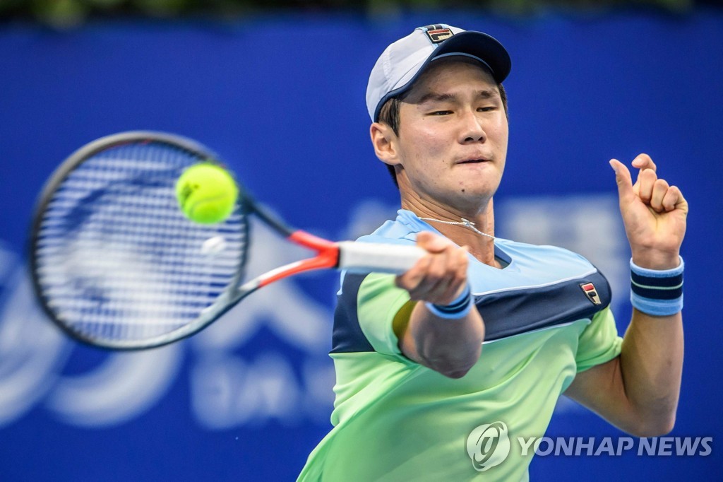 In this AFP photo, Kwon Soon-woo of South Korea hits a return against Lucas Pouille of France during their men's singles first-round match at the Huajin Securities Zhuhai Championships in Zhuhai, China, on Sept. 25, 2019. (Yonhap)