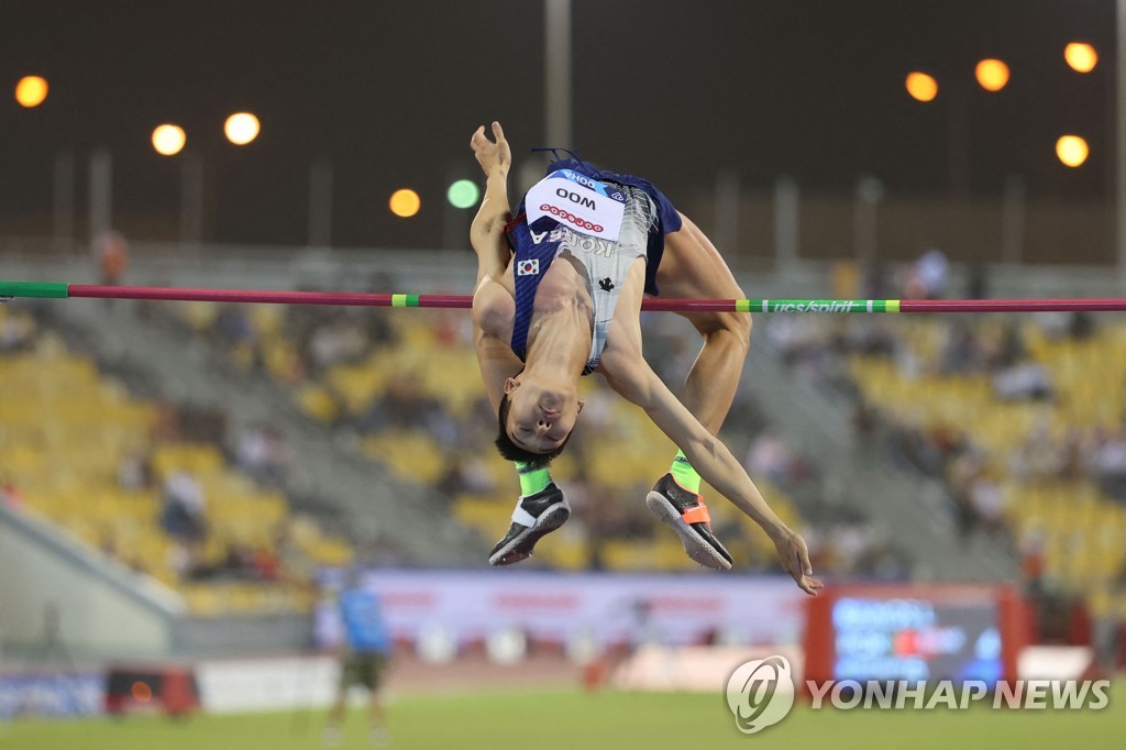In this AFP photo, Woo Sang-hyeok of South Korea competes in the men's high jump event at the World Athletics Diamond League competition at Khalifa International Stadium in Doha on May 13, 2022. (Yonhap)