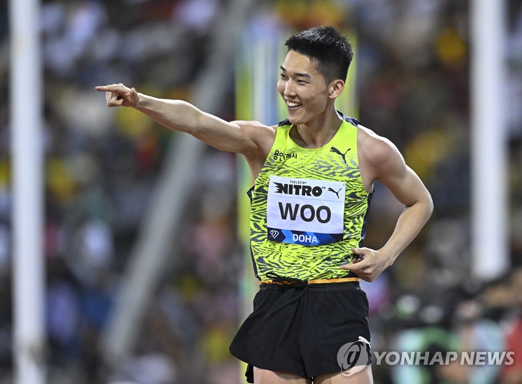 In this EPA file photo from May 5, 2023, Woo Sang-hyeok of South Korea reacts to a successful jump during the men's high jump competition at the Diamond League meet at Suheim bin Hamad Stadium in Doha. (Yonhap)