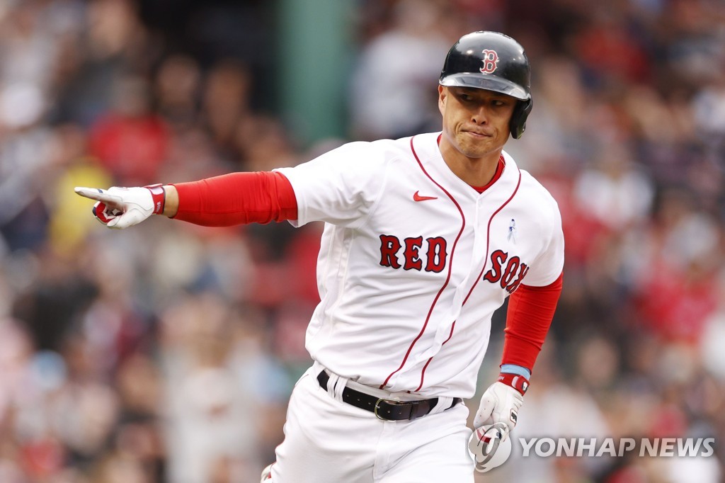 In this Getty Images file photo from June 19, 2022, Rob Refsnyder of the Boston Red Sox celebrates after hitting an RBI single against the St. Louis Cardinals during the bottom of the seventh inning of a Major League Baseball regular season game at Fenway Park in Boston. (Yonhap)