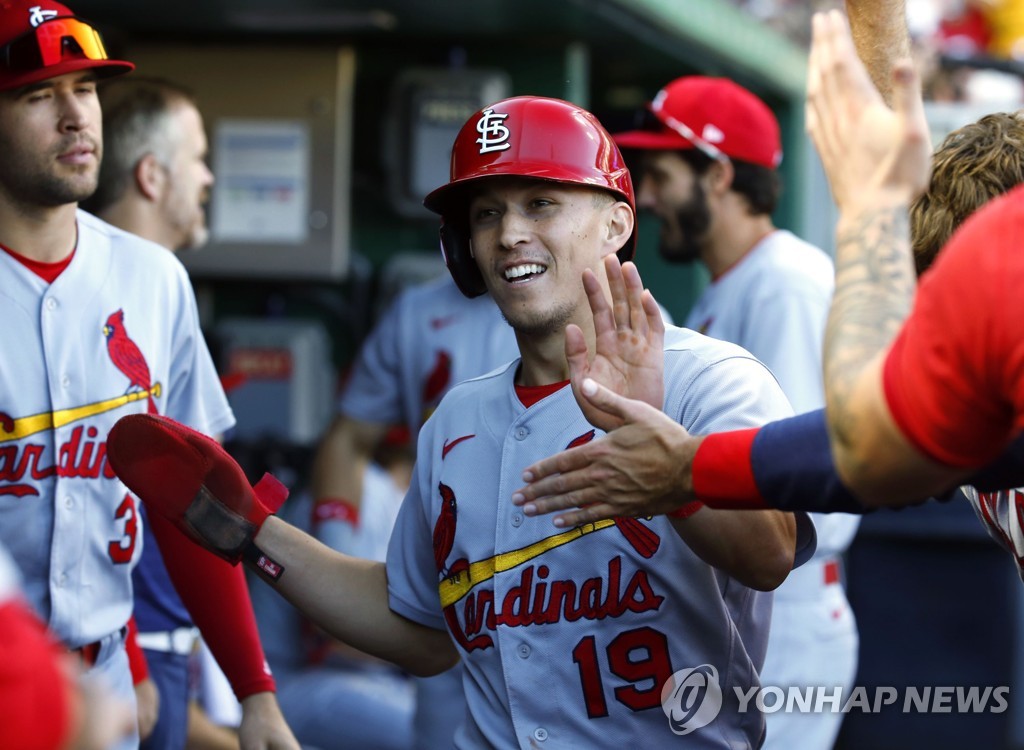 In this Getty Images file photo from Oct. 5, 2022, Tommy Edman of the St. Louis Cardinals celebrates after scoring a run against the Pittsburgh Pirates during the top of the third inning of a Major League Baseball regular season game at PNC Park in Pittsburgh. (Yonhap)