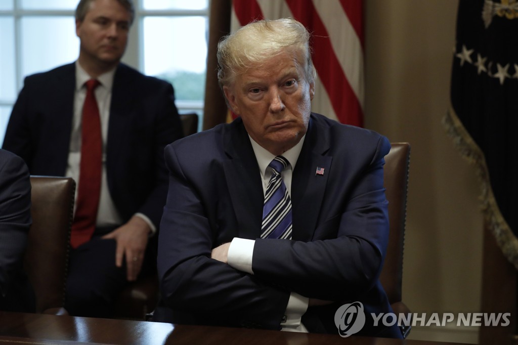 This UPI photo shows U.S. President Donald Trump at a meeting with bankers on the COVID-19 response at the White House in Washington on March 11, 2020. (Yonhap)