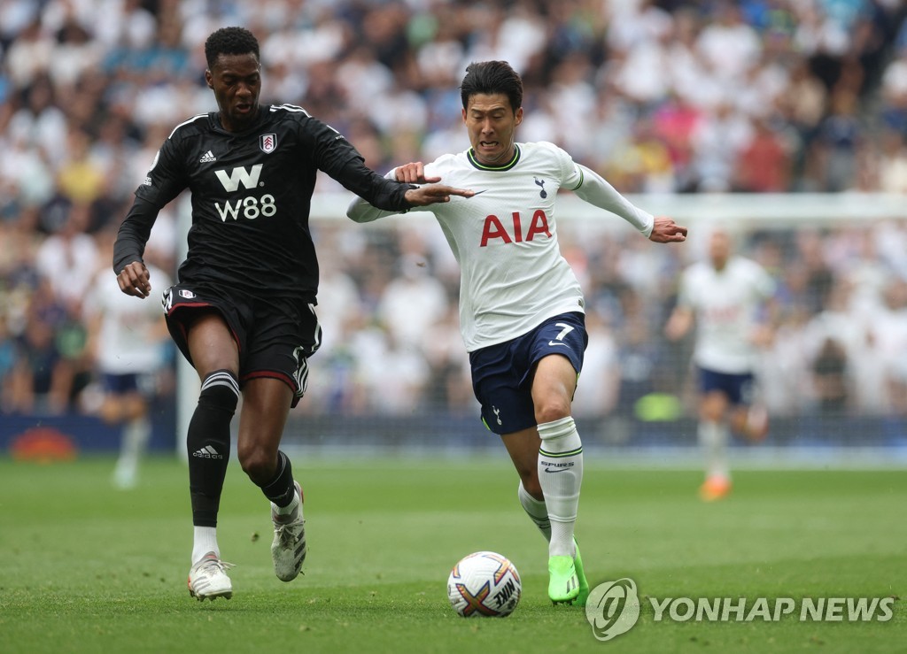 In this Action Images photo via Reuters, Son Heung-min of Tottenham Hotspur (R) tries to get past Tosin Adarabioyo of Fulham FC during the clubs' Premier League match at Tottenham Hotspur Stadium in London on Sept. 3, 2022. (Yonhap)