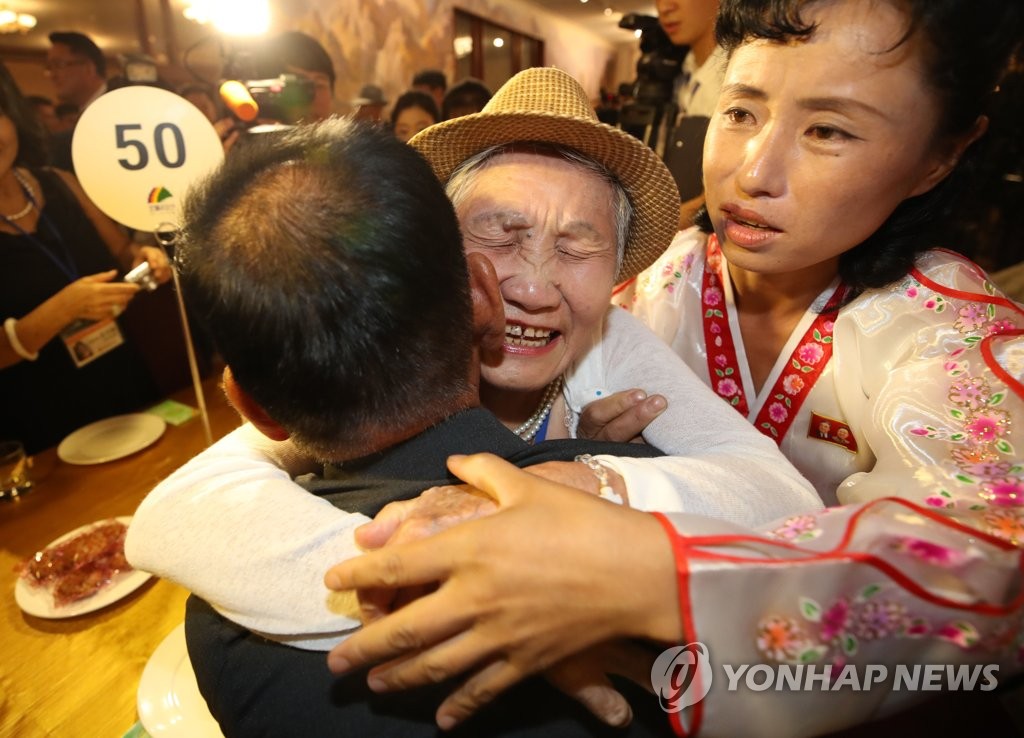 In this file photo, taken Aug. 20, 2018, South Korea's Lee Geum-seom, 92, is seen hugging her son Lee Sang-cheol, 71, at an event at the Kumgang Mountain resort in North Korea's scenic eastern coast for the reunion of families separated by the 1950-53 Korean War. The latest inter-Korean family reunion was the first of its kind in nearly three years. (Pool photo) (Yonhap)