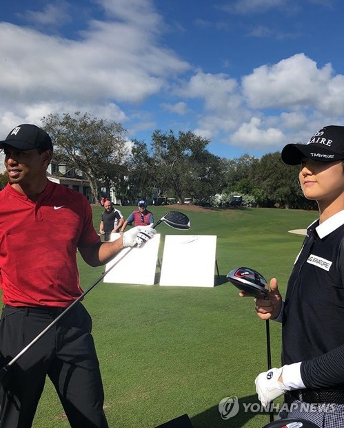 Park Sung-hyun con Tiger Woods