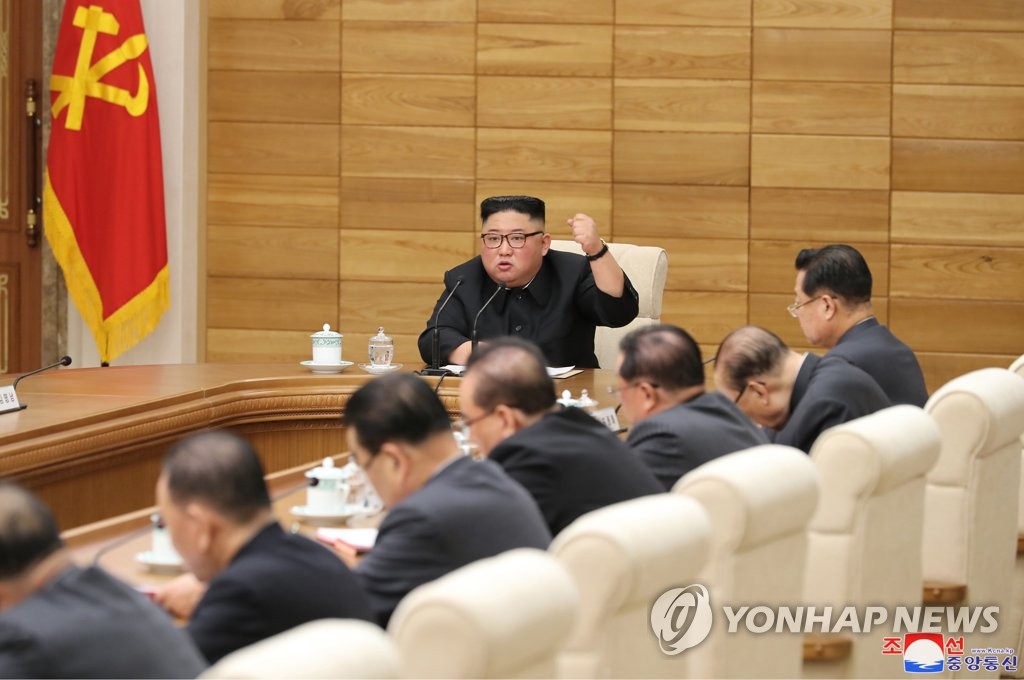 North Korean leader Kim Jong-un speaks with his clenched fist raised at an enlarged meeting of the Political Bureau of the Central Committee of the Workers' Party of Korea in Pyongyang on April 9, 2019, in this photo released by the Korean Central News Agency the next day. (For Use Only in the Republic of Korea. No Redistribution) (Yonhap) 