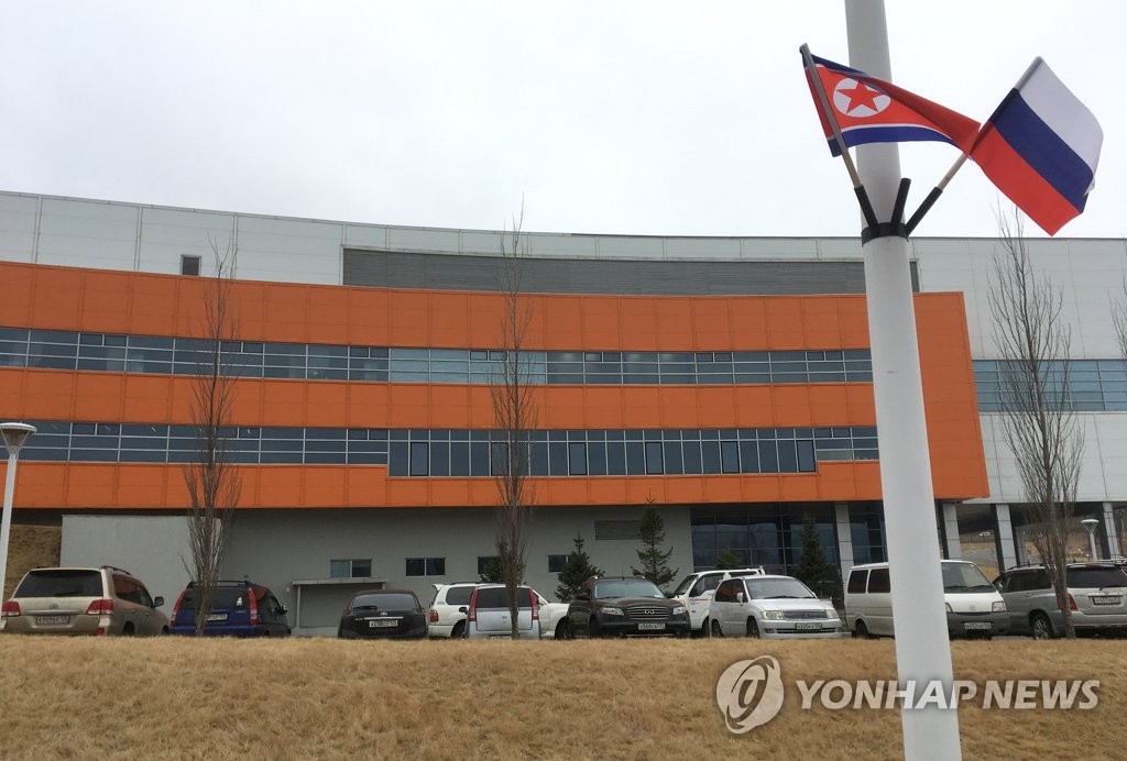 The flags of North Korea and Russia are placed on a light pole on the street of the Far Eastern Federal University, a likely site for the countries' bilateral summit, in Vladivostok on April 23, 2019. (Yonhap)