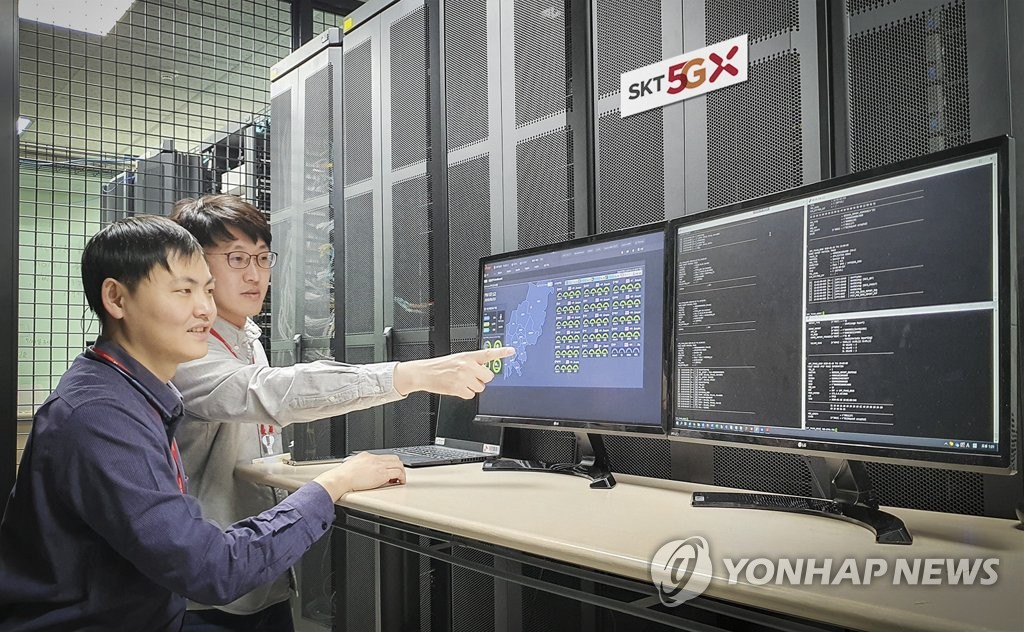This photo provided by SK Telecom on Jan. 20, 2020, shows the company's researchers testing its 5G network communication. (PHOTO NOT FOR SALE) (Yonhap)