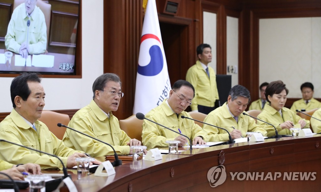 President Moon Jae-in (2nd from L) speaks at an inter-agency meeting on South Korea's response to the new coronavirus outbreak held at the Government Complex Seoul on Jan. 30, 2020. (Yonhap)