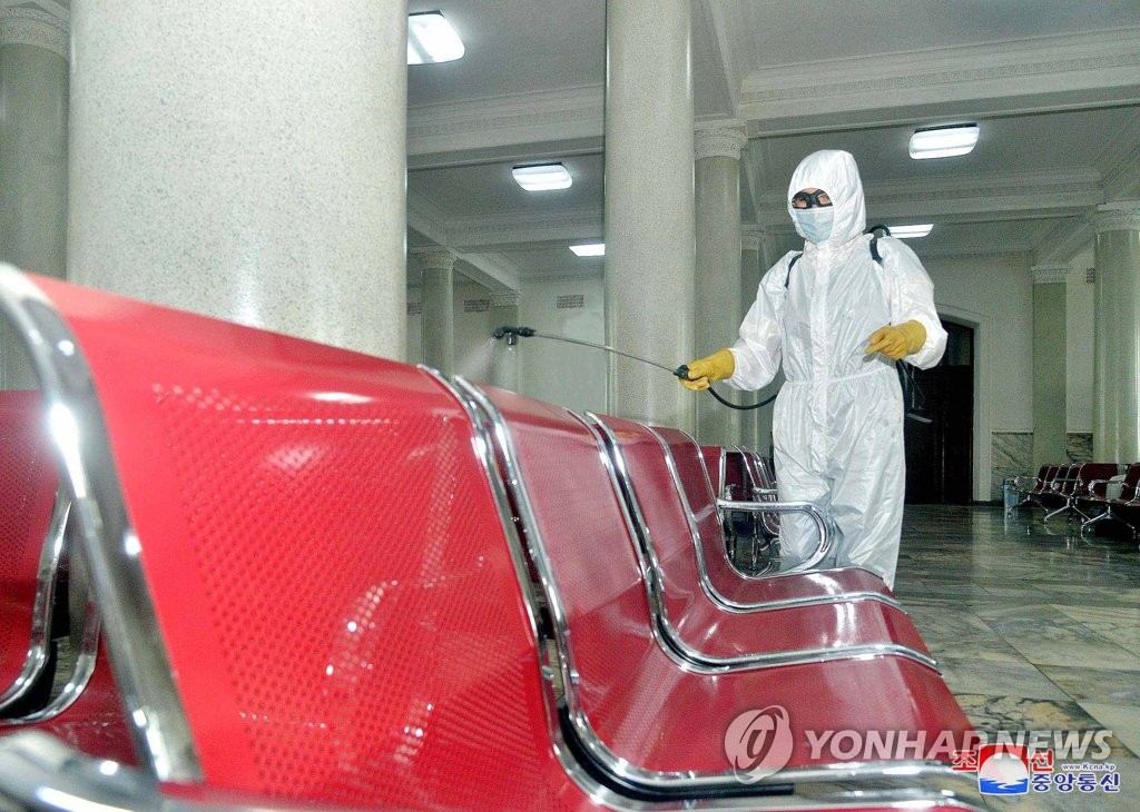 This photo, released by the North's Korean Central News Agency on Aug. 29, 2020, shows a health worker sanitizing Pyongyang Station in the capital to prevent the outbreak of the coronavirus. (For Use Only in the Republic of Korea. No Redistribution) (Yonhap)