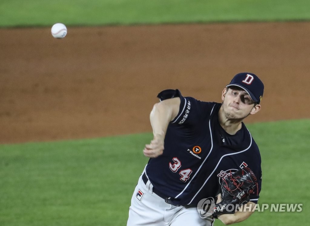 In this file photo from Oct. 20, 2020, Chris Flexen of the Doosan Bears pitches against the Lotte Giants in the bottom of the first inning of a Korea Baseball Organization regular season game at Sajik Stadium in Busan, 450 kilometers southeast of Seoul. (Yonhap)