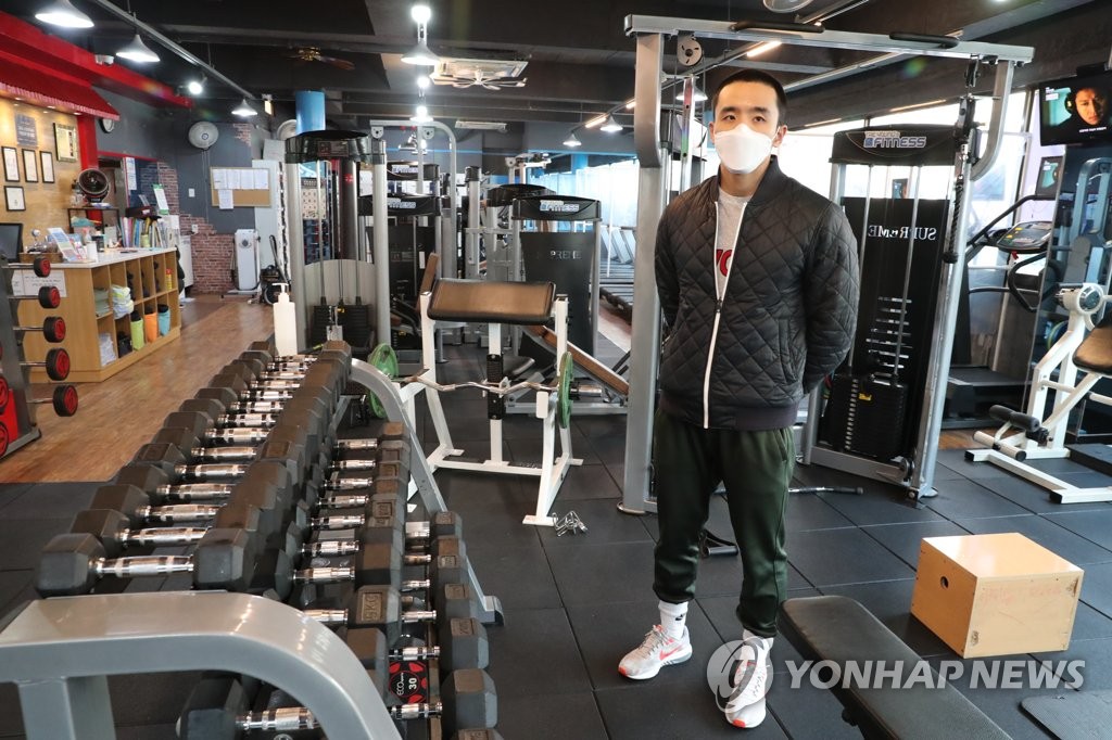 Jeong Tae-young, who runs a gym in Seoul's Mapo Ward, poses inside his gym on Jan. 4, 2021. (Yonhap)