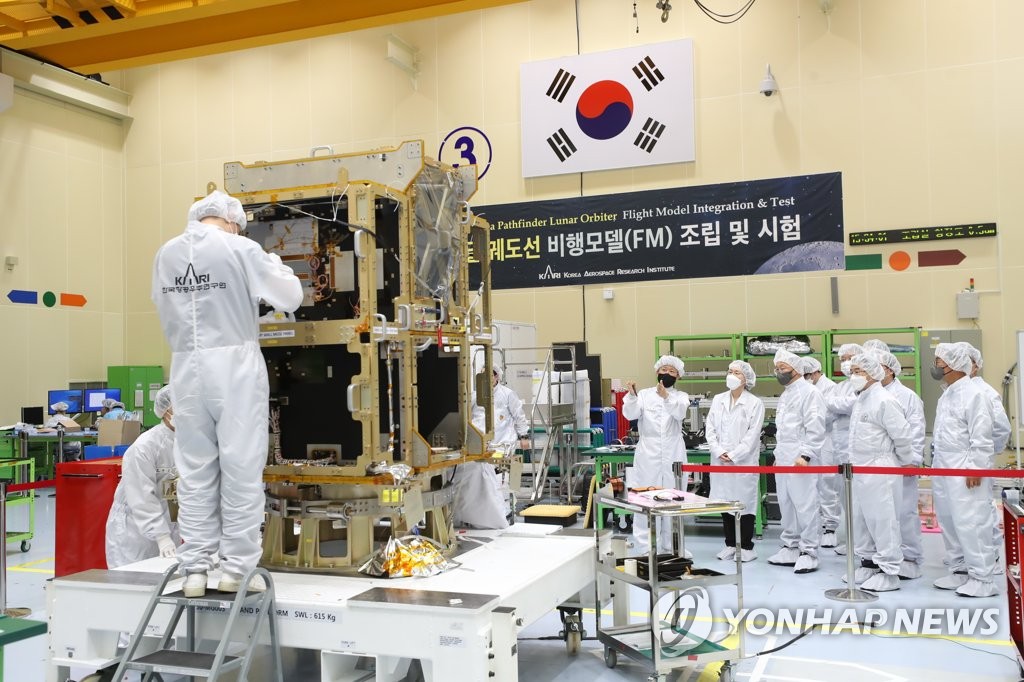 This file photo, taken May 31, 2021, and provided by the Ministry of Science and ICT, shows researchers testing components of a model of South Korea's lunar orbiter at the Korea Aerospace Research Institute in Daejeon, 164 kilometers south of Seoul. (PHOTO NOT FOR SALE) (Yonhap)