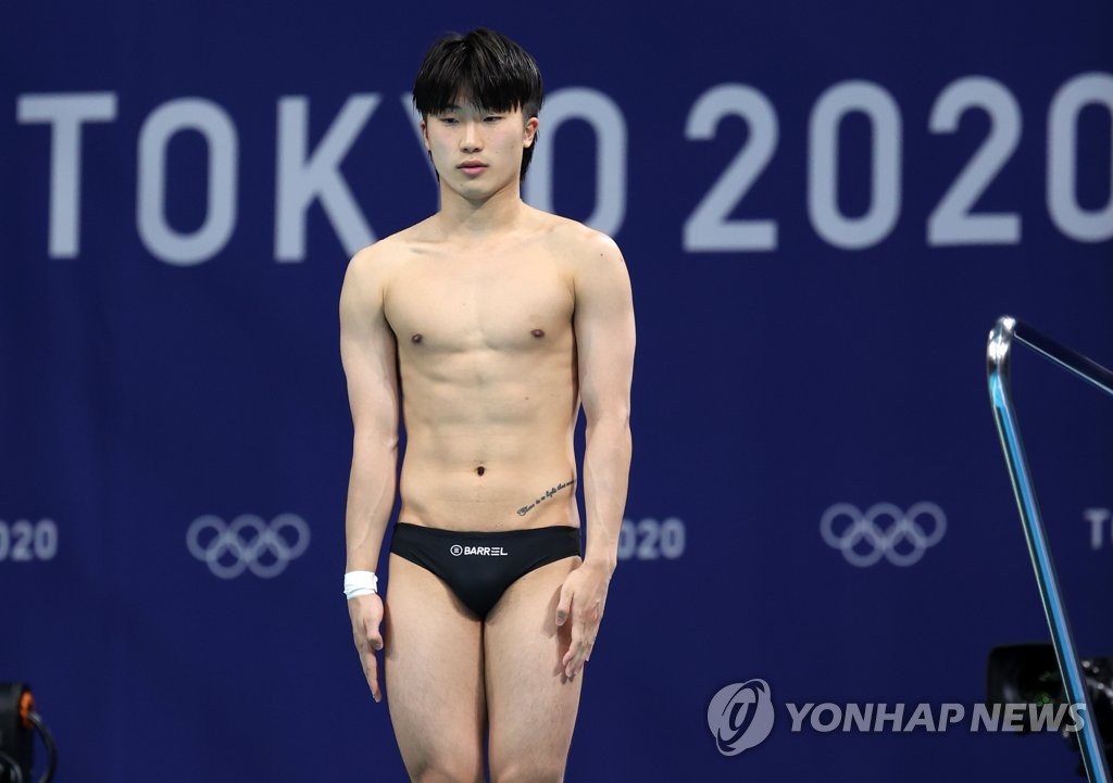 Woo Haram of South Korea prepares for a dive during the final of the men's 3m springboard diving event at the Tokyo Olympics at Tokyo Aquatics Centre in Tokyo on Aug. 3, 2021. (Yonhap)