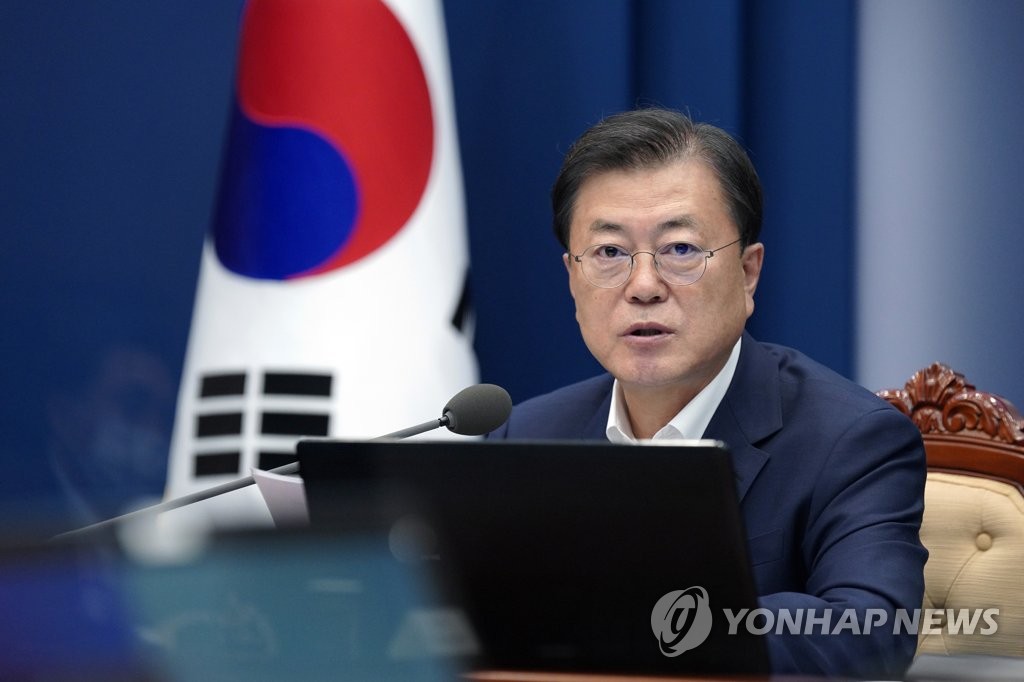 This photo provided by Cheong Wa Dae on Aug. 5, 2021, shows President Moon Jae-in speaks during a government vaccine hub strategy meeting held at his office. (PHOTO NOT FOR SALE) (Yonhap)