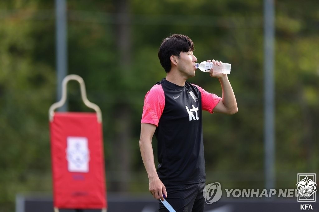 Son Heung-min, captain of the South Korean men's national football team, drinks water during practice at the National Football Center in Paju, Gyeonggi Province, on Sept. 4, 2021, in this photo provided by the Korea Football Association. (PHOTO NOT FOR SALE) (Yonhap)