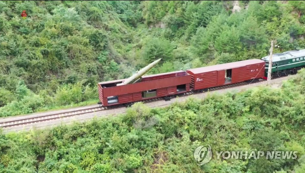 This photo, captured from North Korea's official Korean Central Television on Sept. 16, 2021, shows a short-range ballistic missile on a train before being fired the previous day. (For Use Only in the Republic of Korea. No Redistribution) (Yonhap)