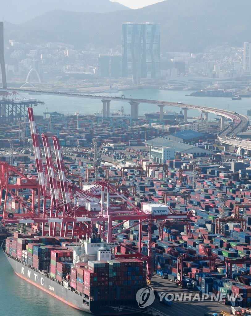 Containers for exports and imports are stacked at a pier in South Korea's largest port city of Busan on Oct. 26, 2021. South Korea's trade volume for this year surpassed the US$1 trillion mark around 1:53 p.m. the same day on the back of solid export growth amid the global recovery from the pandemic, reaching the milestone at the fastest pace ever, the trade ministry said. (Yonhap)
