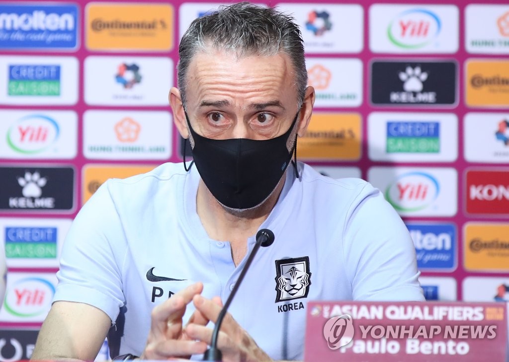 In this file photo from Nov. 16, 2021, South Korea head coach Paulo Bento speaks at a press conference after a 3-0 win over Iraq in the teams' Group A match in the final Asian qualifying round for the 2022 FIFA World Cup at Thani bin Jassim Stadium in Doha. (Yonhap)