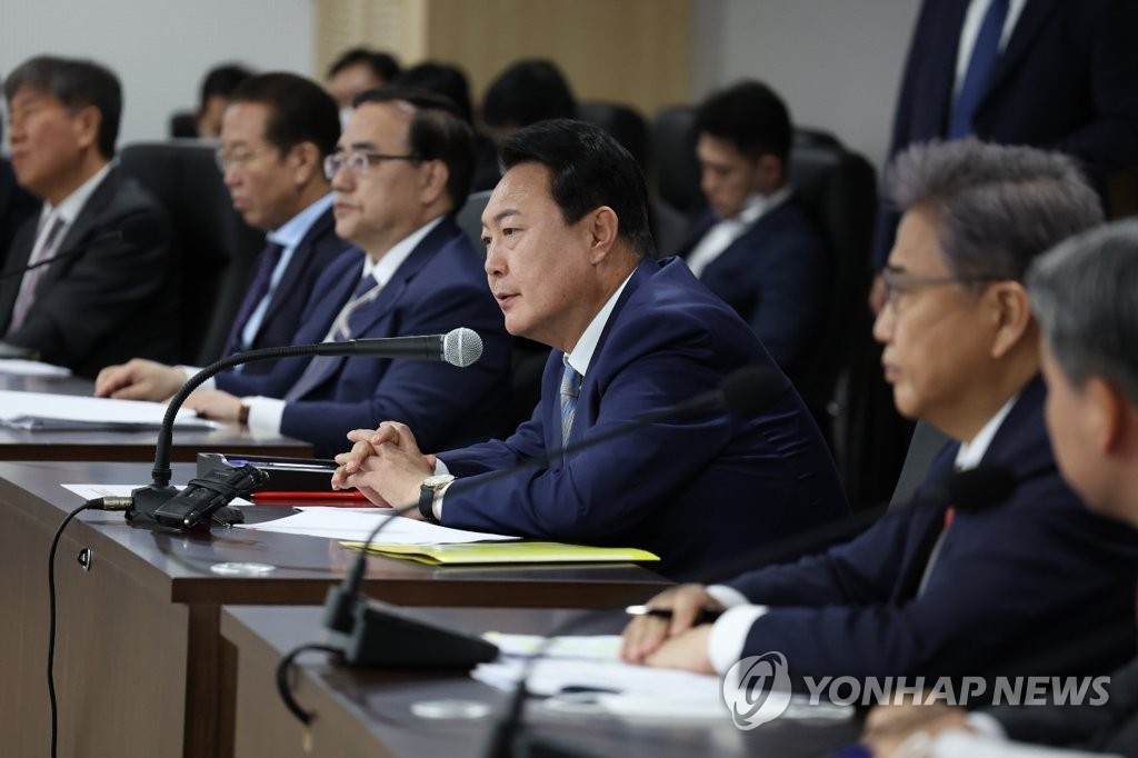 President-elect Yoon Suk-yeol presides over a meeting with his top security officials at the new national crisis management center inside the defense ministry compound that is being renovated into the new presidential office in Seoul's central district of Yongsan on May 6, 2022, in this photo provided by his office. (PHOTO NOT FOR SALE) (Yonhap)
