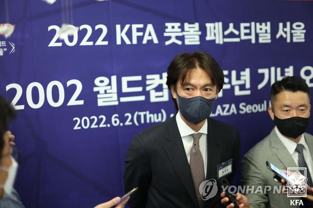 Hong Myung-bo (C), a member of the South Korean men's national football team at the 2002 FIFA World Cup, speaks to reporters before attending a luncheon in Seoul celebrating the 20th anniversary of the World Cup on June 2, 2022, in this photo provided by the Korea Football Association. (PHOTO NOT FOR SALE) (Yonhap)