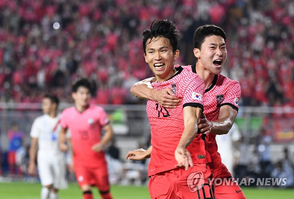 Jeong Woo-yeong of South Korea (L) celebrates his goal against Paraguay with teammate Cho Gue-sung during the countries' friendly football match at Suwon World Cup Stadium in Suwon, 35 kilometers south of Seoul, on June 10, 2022. (Yonhap)