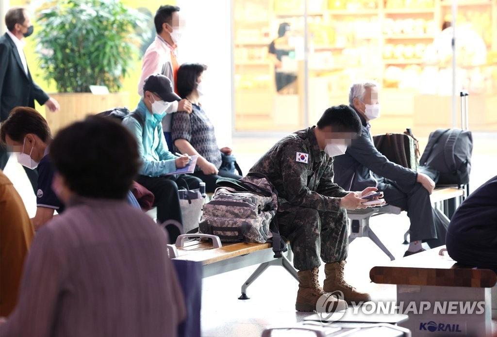 This file photo taken June 17, 2022, shows a service member waiting for a train at Seoul Station in central Seoul. (Yonhap)