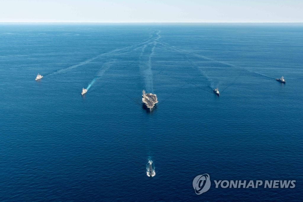 This file photo, provided by the South Korean Navy, shows naval ships, including the USS Ronald Reagan aircraft carrier, participating in a joint anti-submarine drill of South Korea, the United States and Japan in the East Sea on Sept. 30, 2022. (PHOTO NOT FOR SALE) (Yonhap)
