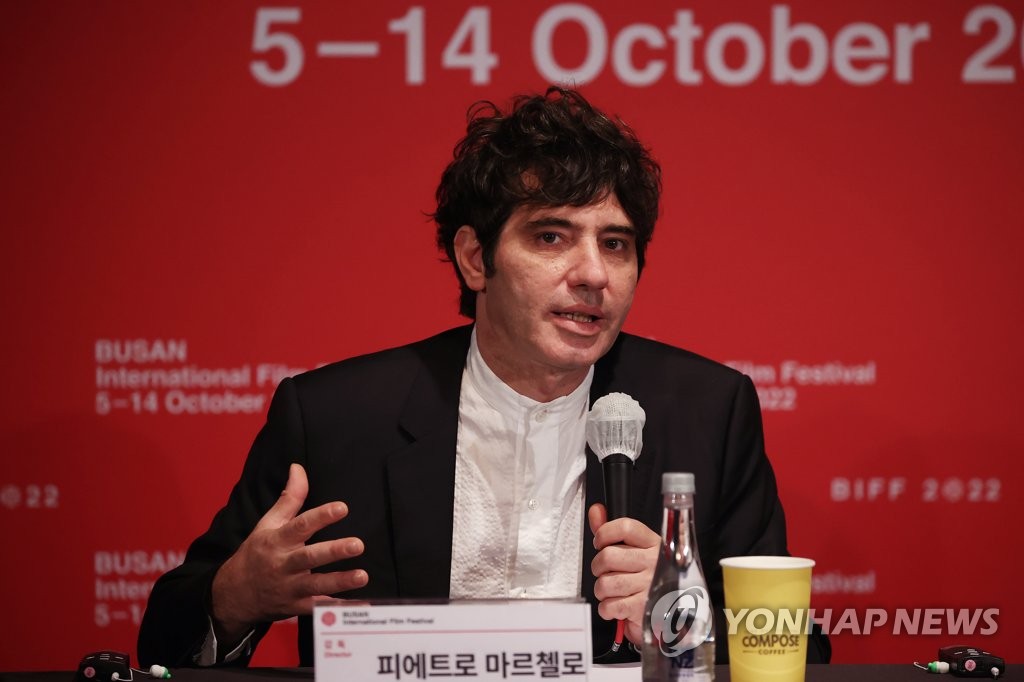 Italian director Pietro Marcello talks about his French-language feature debut "Scarlet" during a press conference in the southeastern port city of Busan on Oct. 8, 2022. (Yonhap)