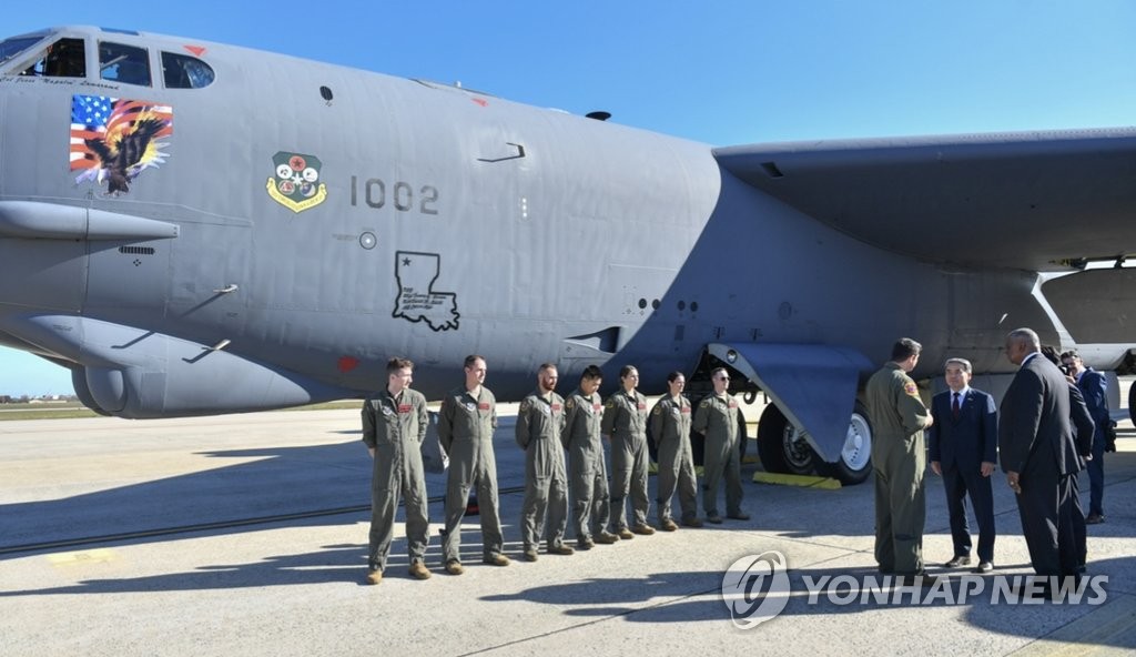 South Korean Defense Minister Lee Jong-sup (2nd from R) and his U.S. counterpart, Lloyd Austin (R), are briefed on B-1B and B-52 strategic bombers during a visit to Joint Base Andrews in Prince George's County, Maryland, on Nov. 3, 2022, in this photo provided by Seoul's defense ministry. (PHOTO NOT FOR SALE) (Yonhap)