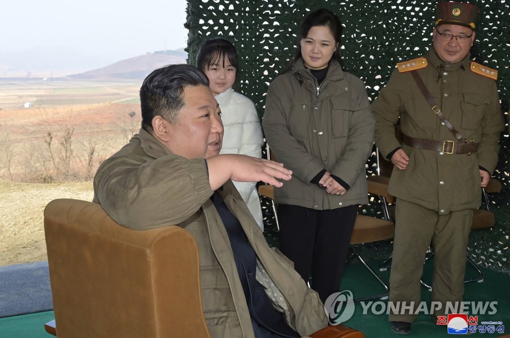 North Korean leader Kim Jong-un (front), accompanied by his wife Ri Sol-ju (C, rear) and his daughter (L, rear), speaks during the launch of a new type of the Hwasong-17 intercontinental ballistic missile (ICBM) at Pyongyang International Airport on Nov. 18, 2022, in this photo released by the North's official Korean Central News Agency. (For Use Only in the Republic of Korea. No Redistribution) (Yonhap)