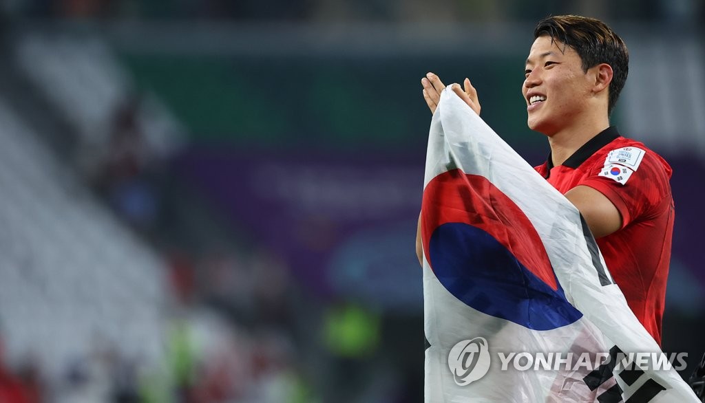 Hwang Hee-chan of South Korea celebrates his team's advance to the round of 16 at the FIFA World Cup following a 2-1 victory over Portugal in a Group H match at Education City Stadium in Al Rayyan, west of Doha, on Dec. 2, 2022. (Yonhap)