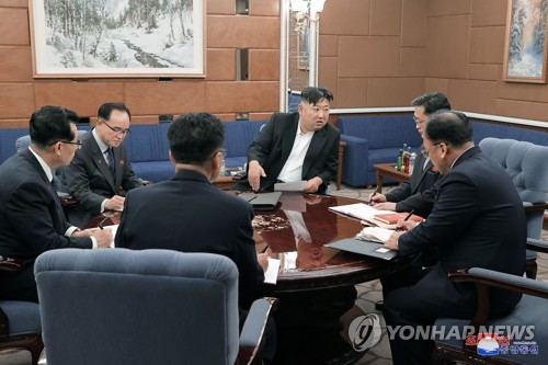 This photo, carried by North Korea's official Korean Central News Agency on Dec. 30, 2022, shows North Korean leader Kim Jong-un (C) speaking with key party officials as the country held a plenary meeting of the ruling Workers' Party of Korea the previous day. (For Use Only in the Republic of Korea. No Redistribution) (Yonhap)
