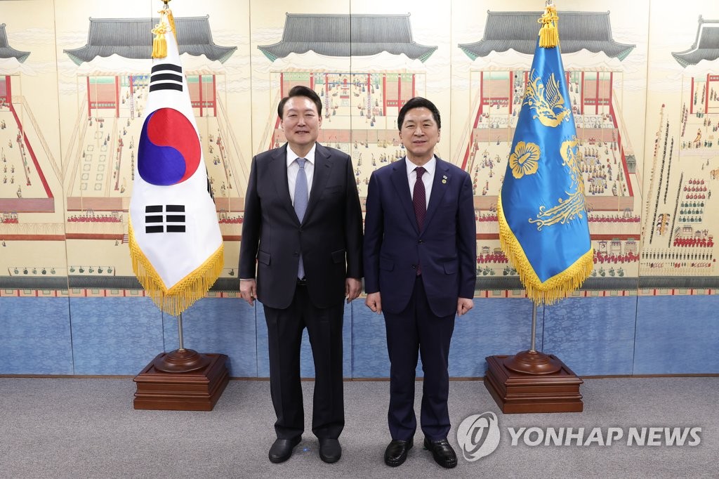President Yoon Suk Yeol (L) and the newly elected ruling People Power Party leader, Kim Gi-hyeon, pose for a photo during a dinner meeting at the presidential office in central Seoul on March 13, 2023, in this photo provided by Yoon's office. (PHOTO NOT FOR SALE) (Yonhap)