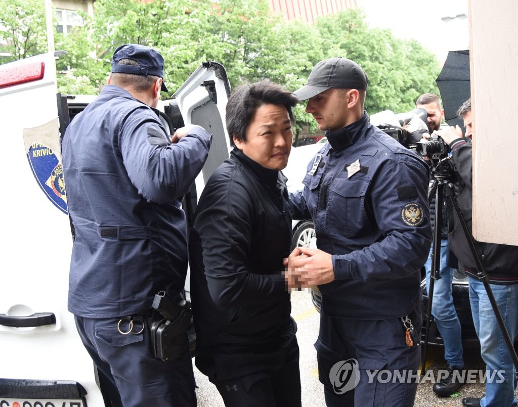 This photo provided by Vijesti shows Do Kwon, co-founder of Terraform Labs, heading to a court in Podgorica, Montenegro, on May 11, 2023. (PHOTO NOT FOR SALE) (Yonhap)