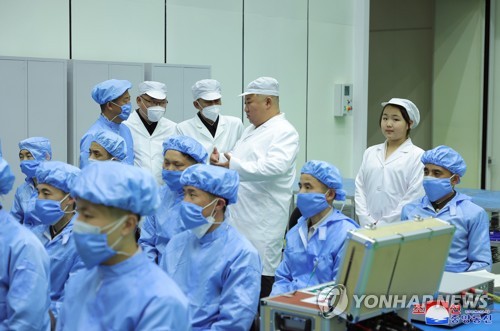 N. Korean leader inspects military spy satellite: state media